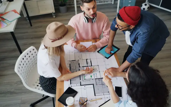 An agency team planning around a table